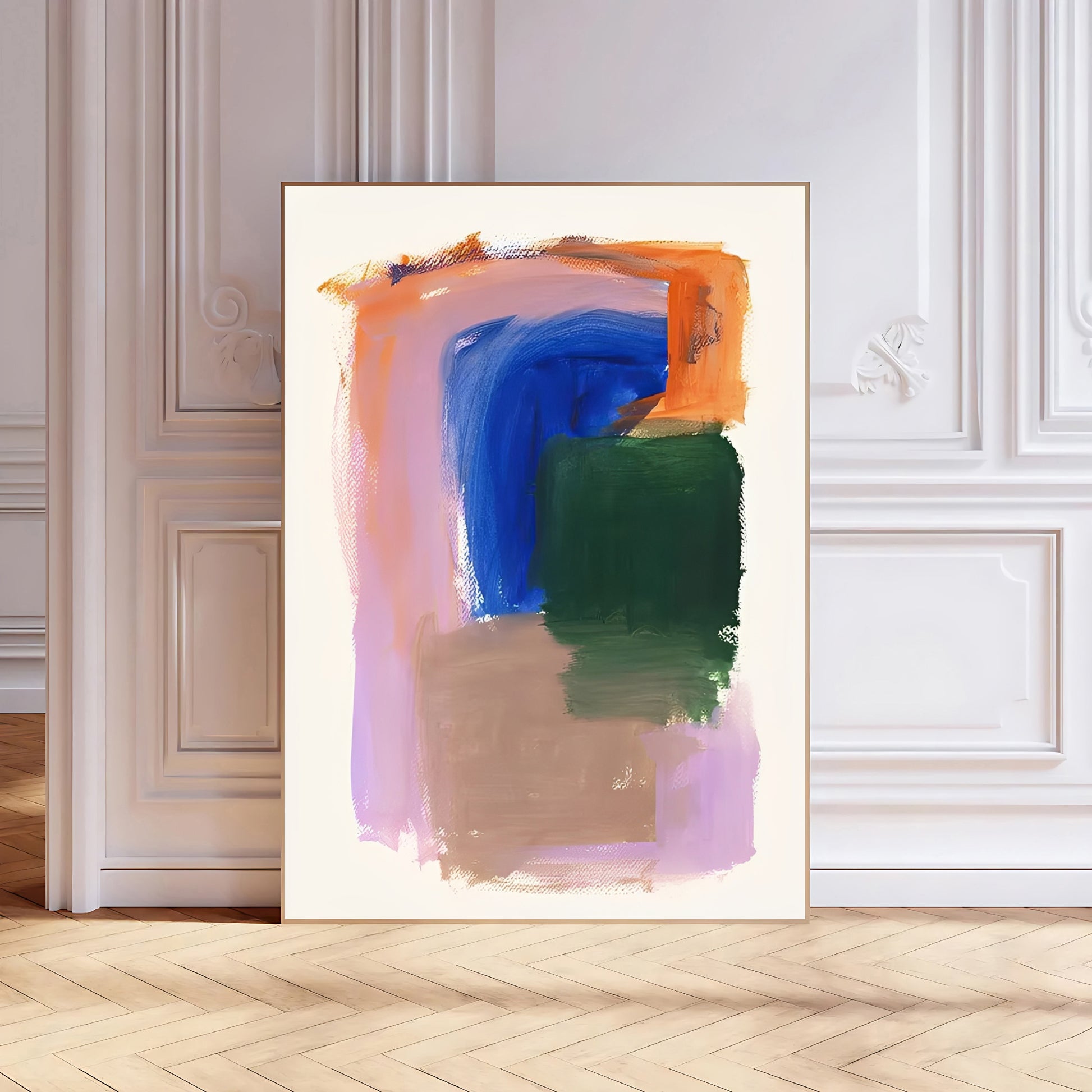 Abstract art print in a gold frame on a wall with wooden flooring.