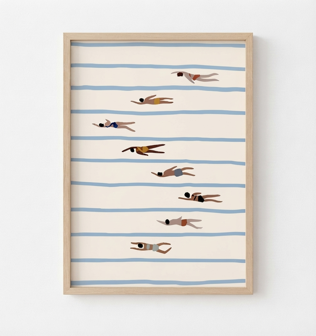 Framed wall art featuring a minimalist illustration of swimmers on horizontal blue stripes against a warm cream background, shown in a light wood frame on a white wall.