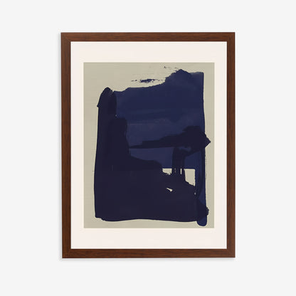 Framed abstract art piece with a dark blue shape on a beige background