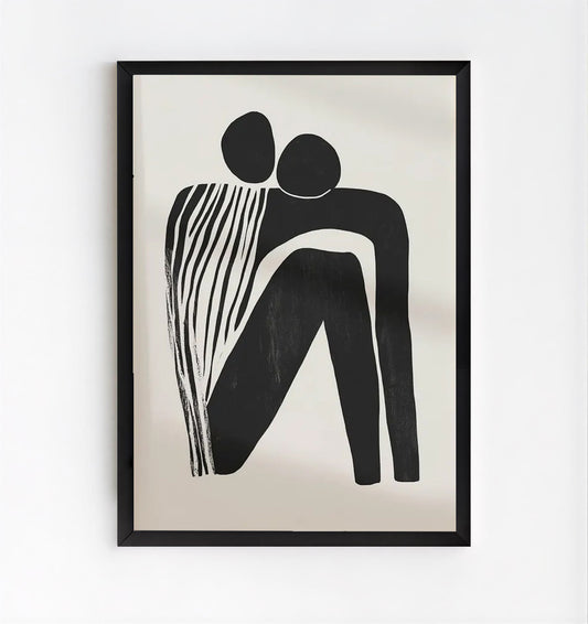 Framed black and white abstract artwork on a beige background