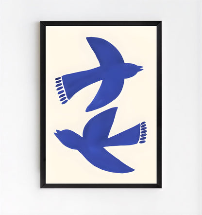 Framed artwork with blue bird silhouettes on a beige background