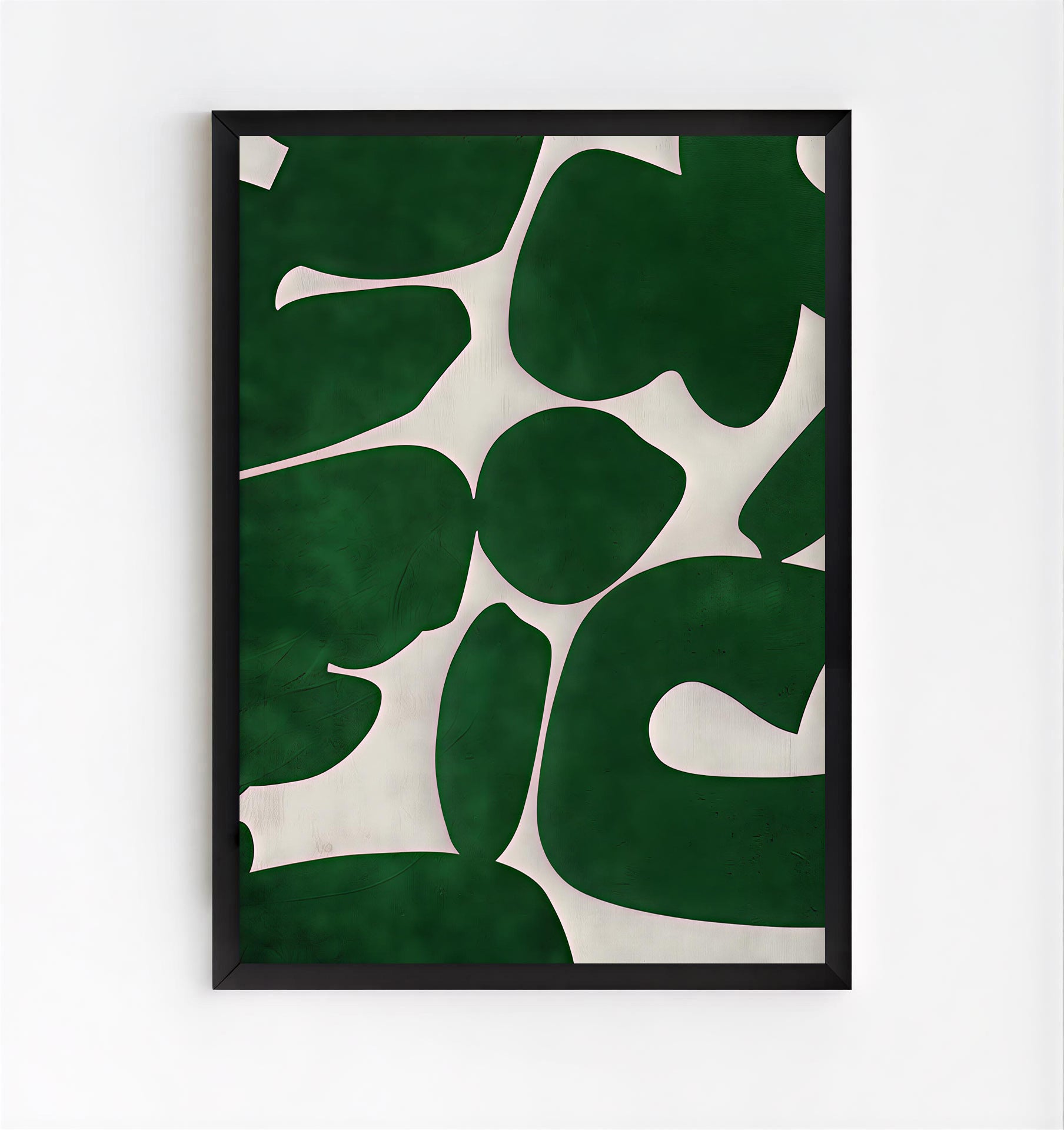 Framed artwork with green leaf pattern on a white background