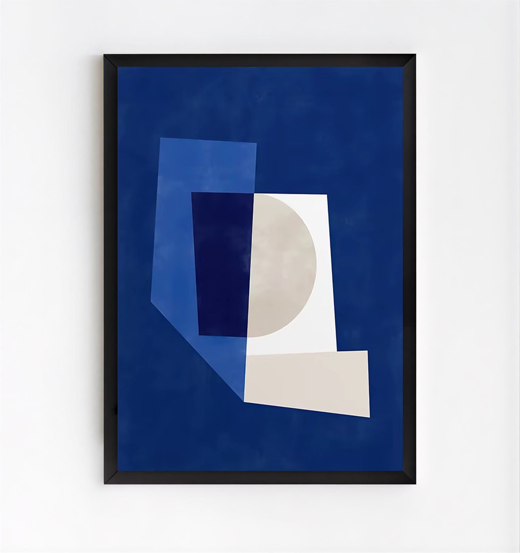Framed abstract art print with geometric shapes on a blue background