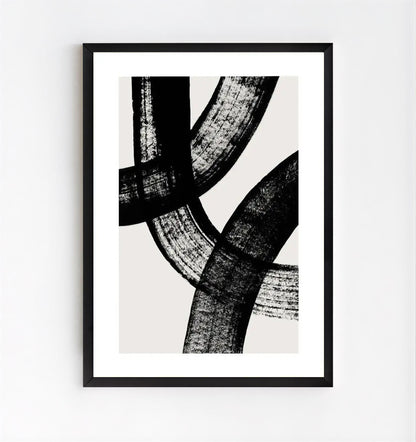 Framed abstract art print with black and white brushstroke design on a light gray background