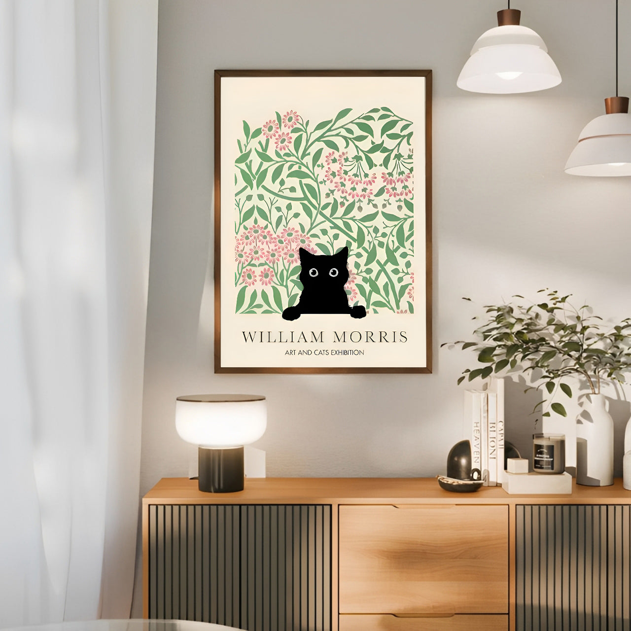 Framed artwork with a black cat and floral design on a wall above a wooden console table.