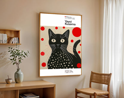 Poster of a black cat with red and white polka dots by Yayoi Kusama in a room with a wooden shelf and chair.