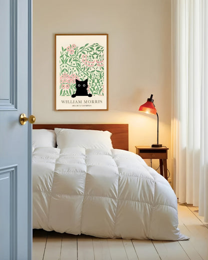 Bedroom with white bedding, wooden headboard, and framed artwork on wall.