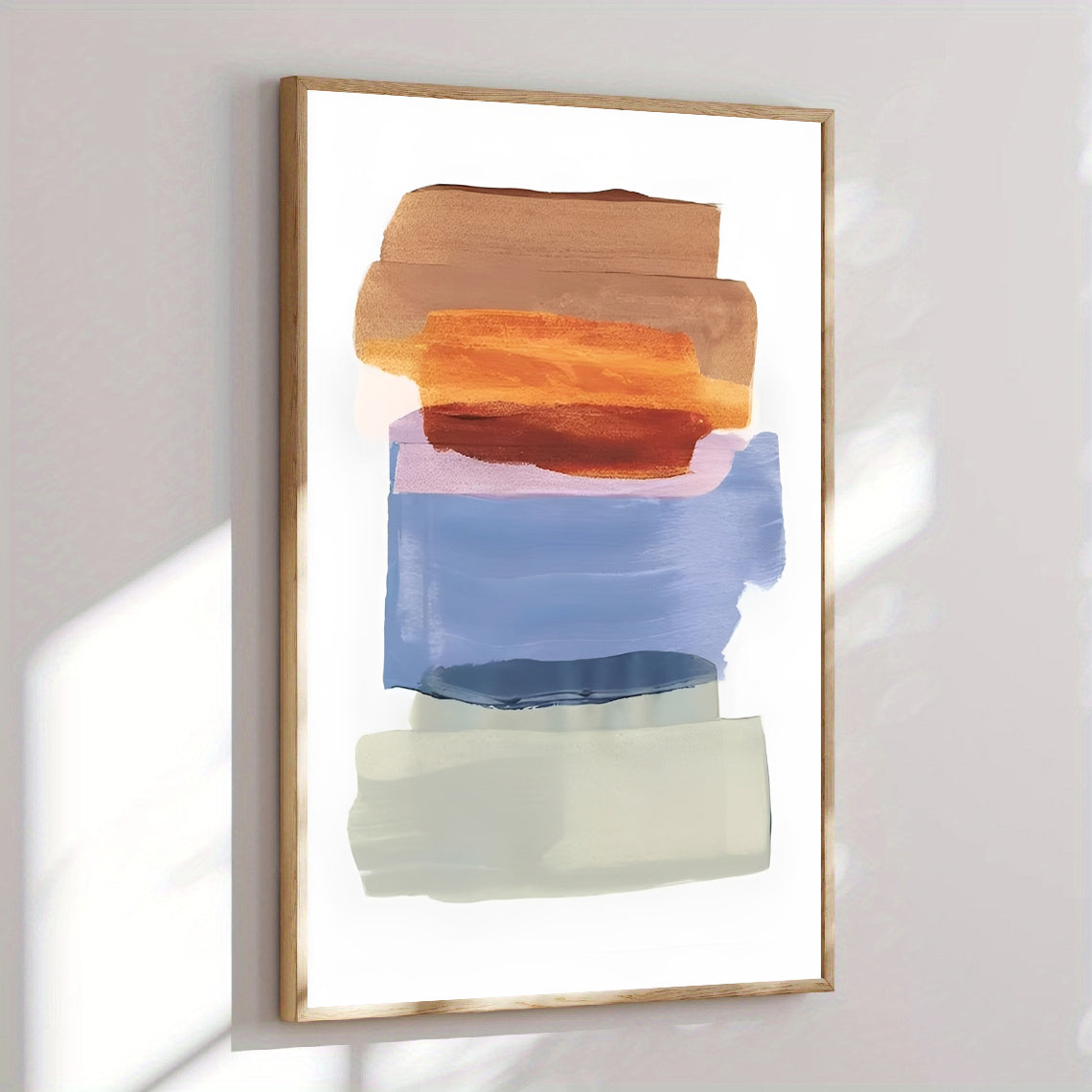 Abstract art print with colorful brush strokes in a wooden frame on a white wall.