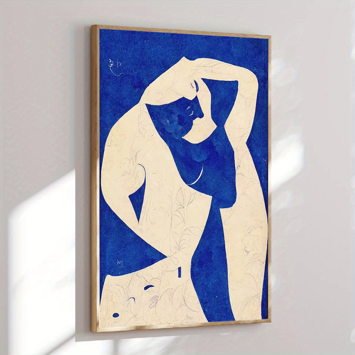Framed artwork of a stylized figure on a blue background