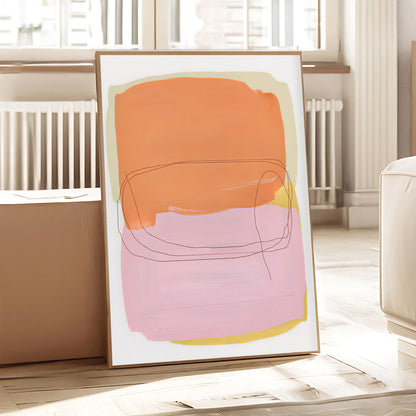 Abstract art print with orange, pink, and yellow colors on a white background, displayed in a room.