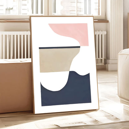 Abstract art print with geometric shapes in a minimalistic room.
