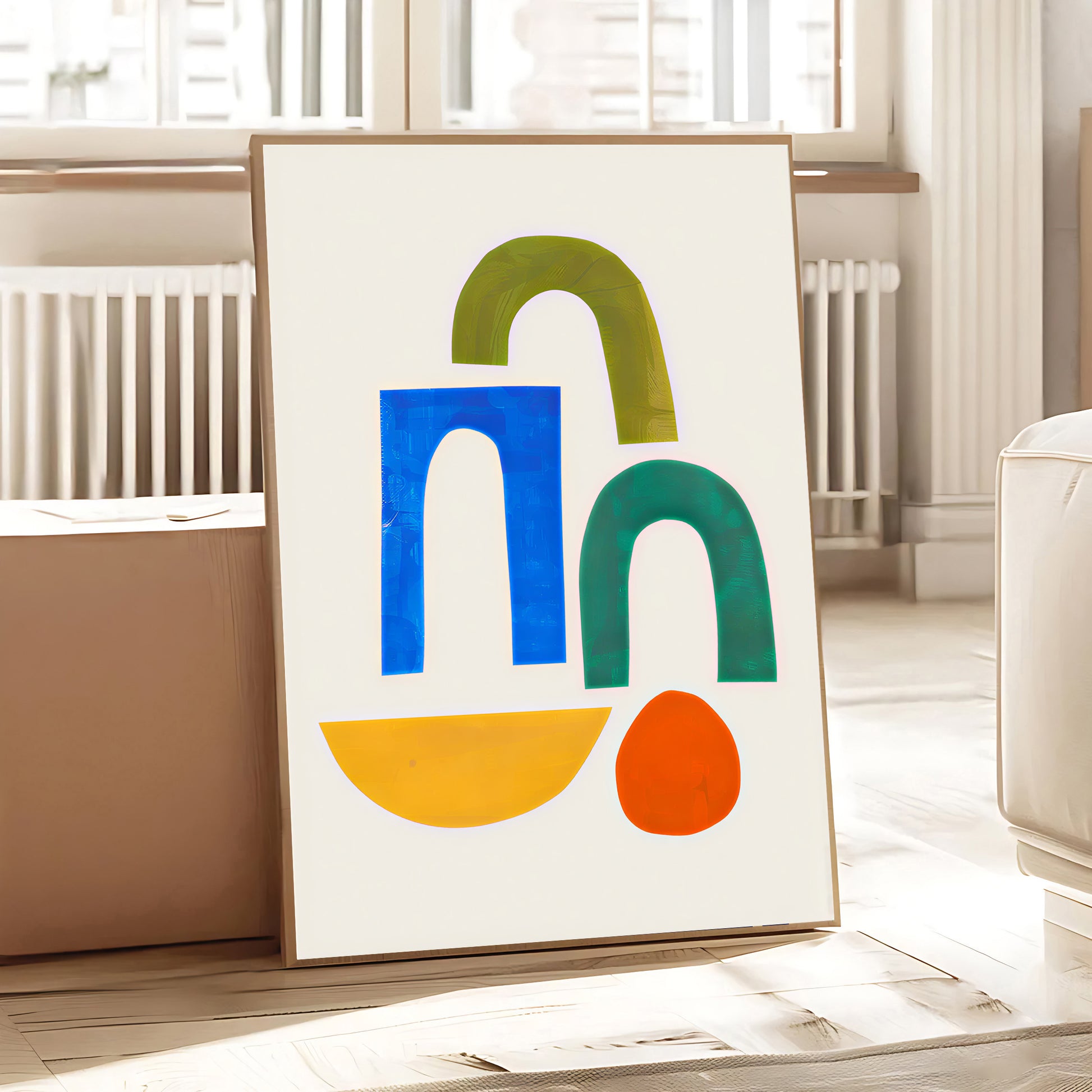 Colorful abstract art print on a table in a room with light-colored walls and furniture.