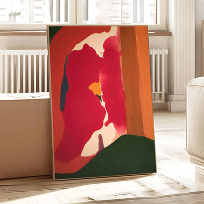 Abstract art piece with vibrant colors on a stand in a room with light-colored walls and furniture.