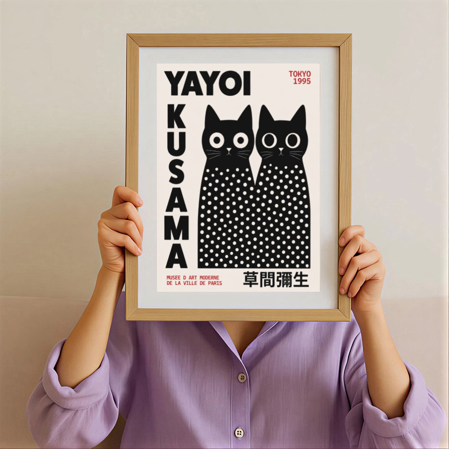Framed artwork by Yayoi Kusama Inspired Black Cat Poster with white polka dots on a beige background.