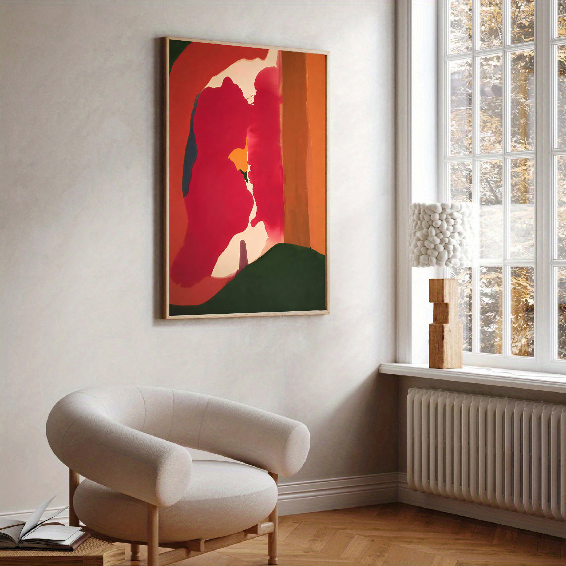 Modern interior with a colorful abstract painting on the wall and a beige armchair.