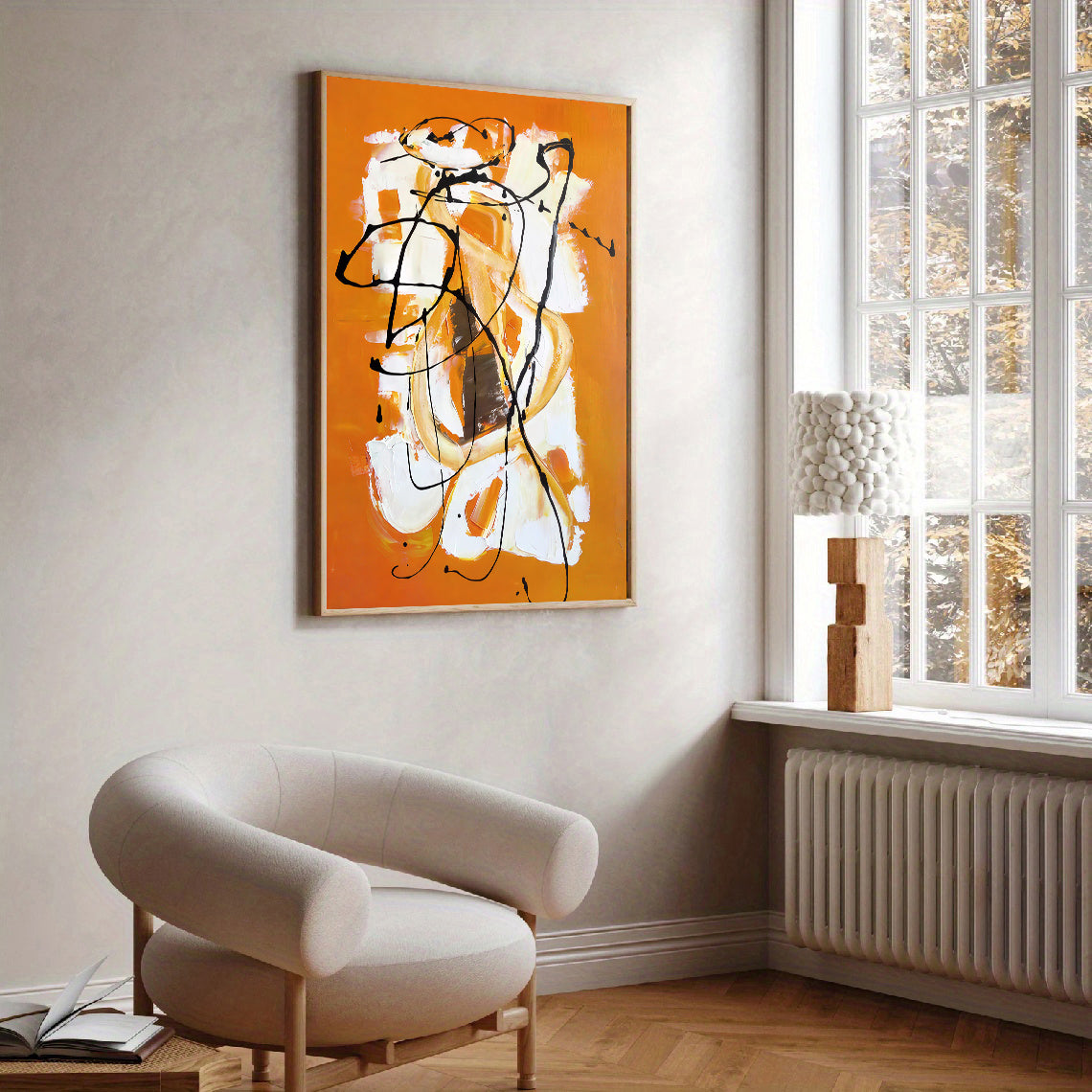Abstract art on an orange background in a modern living room.