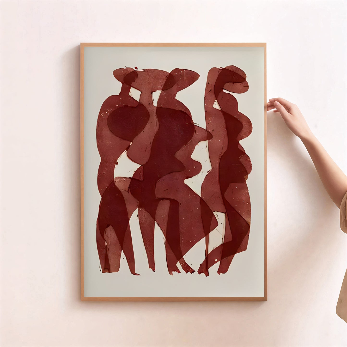 Framed abstract art with red shapes on a light background