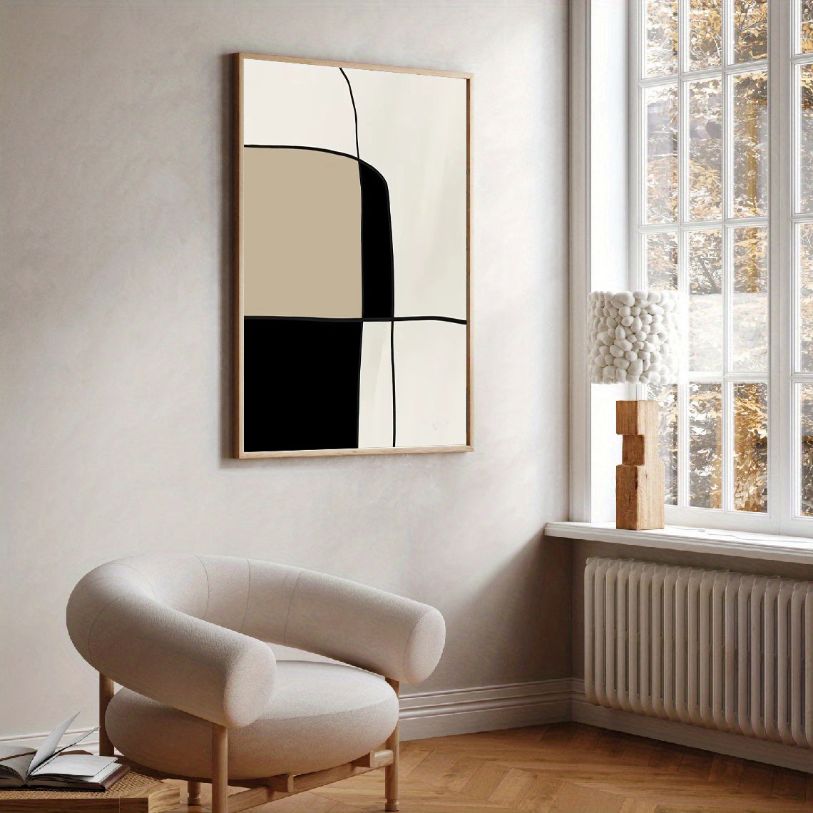 Modern interior with abstract art on the wall and a chair near a window.