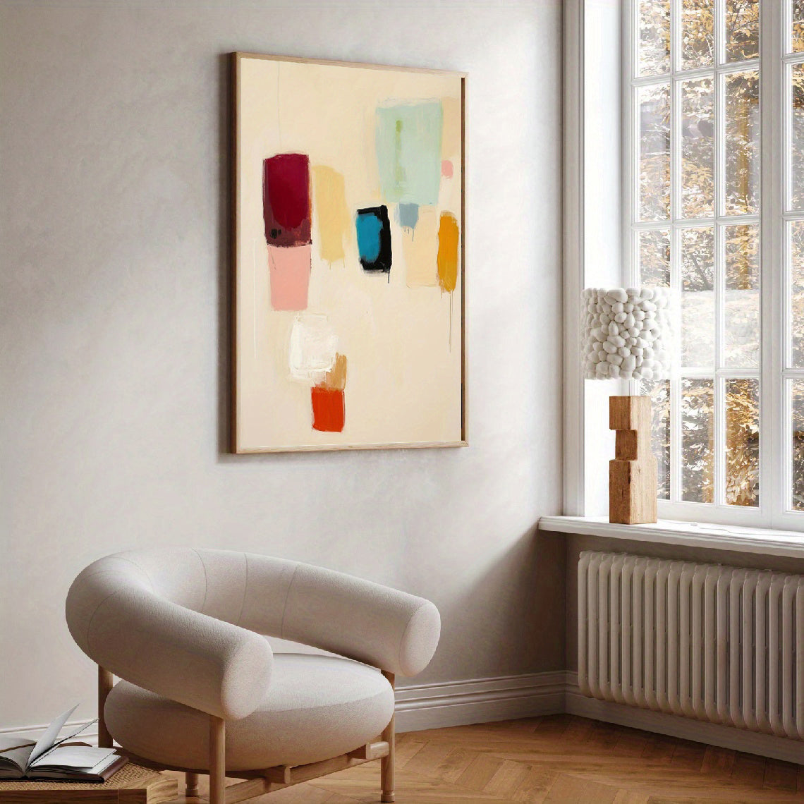Modern interior with abstract art on the wall and a chair near a window.