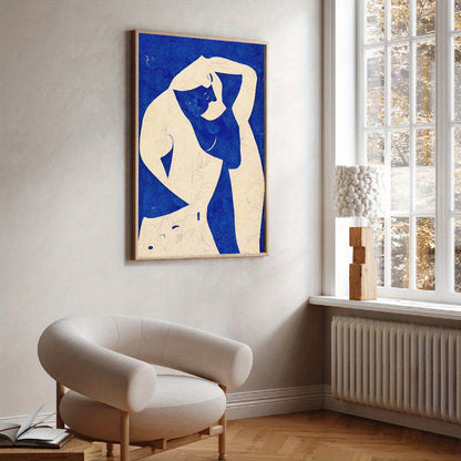 Modern interior with a blue and white abstract painting of a nude figure on a wall.