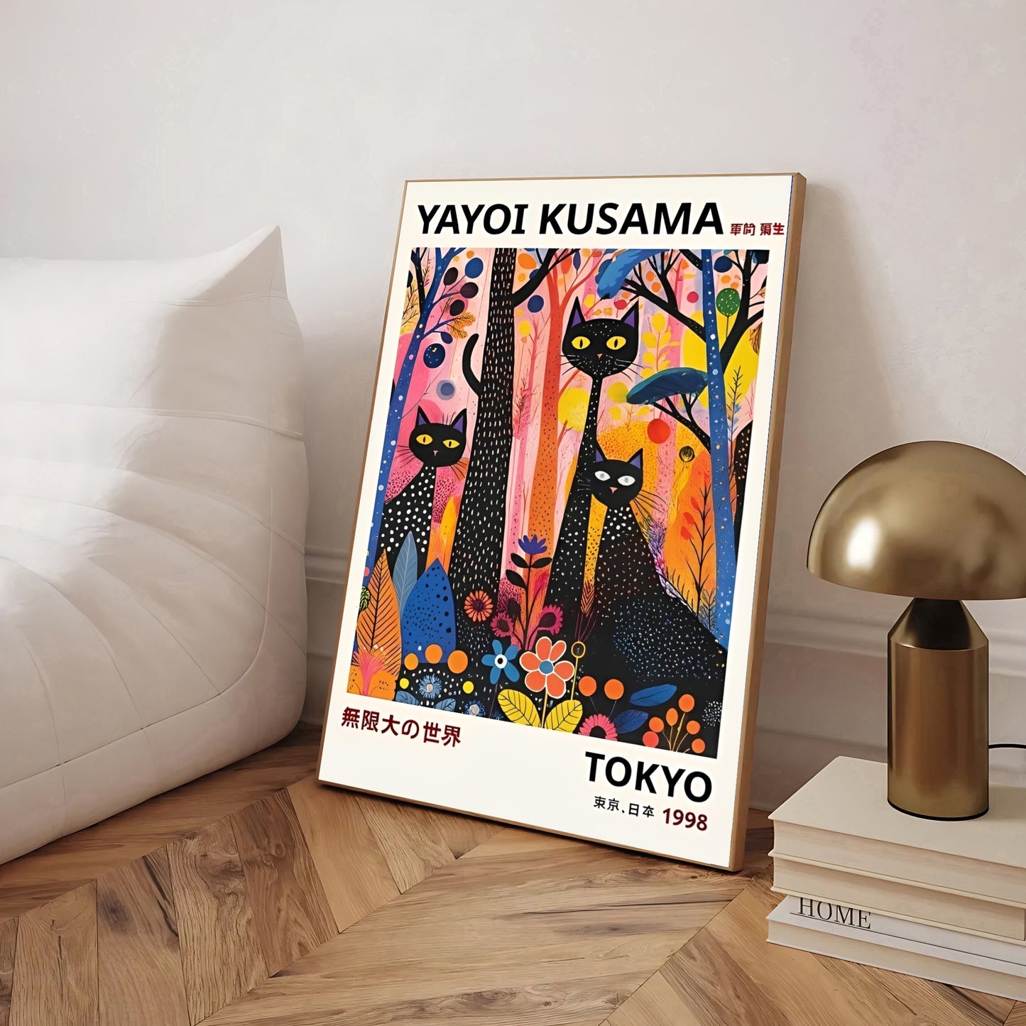 Framed Yayoi Kusama artwork black cats and colorful trees in a room setting.
