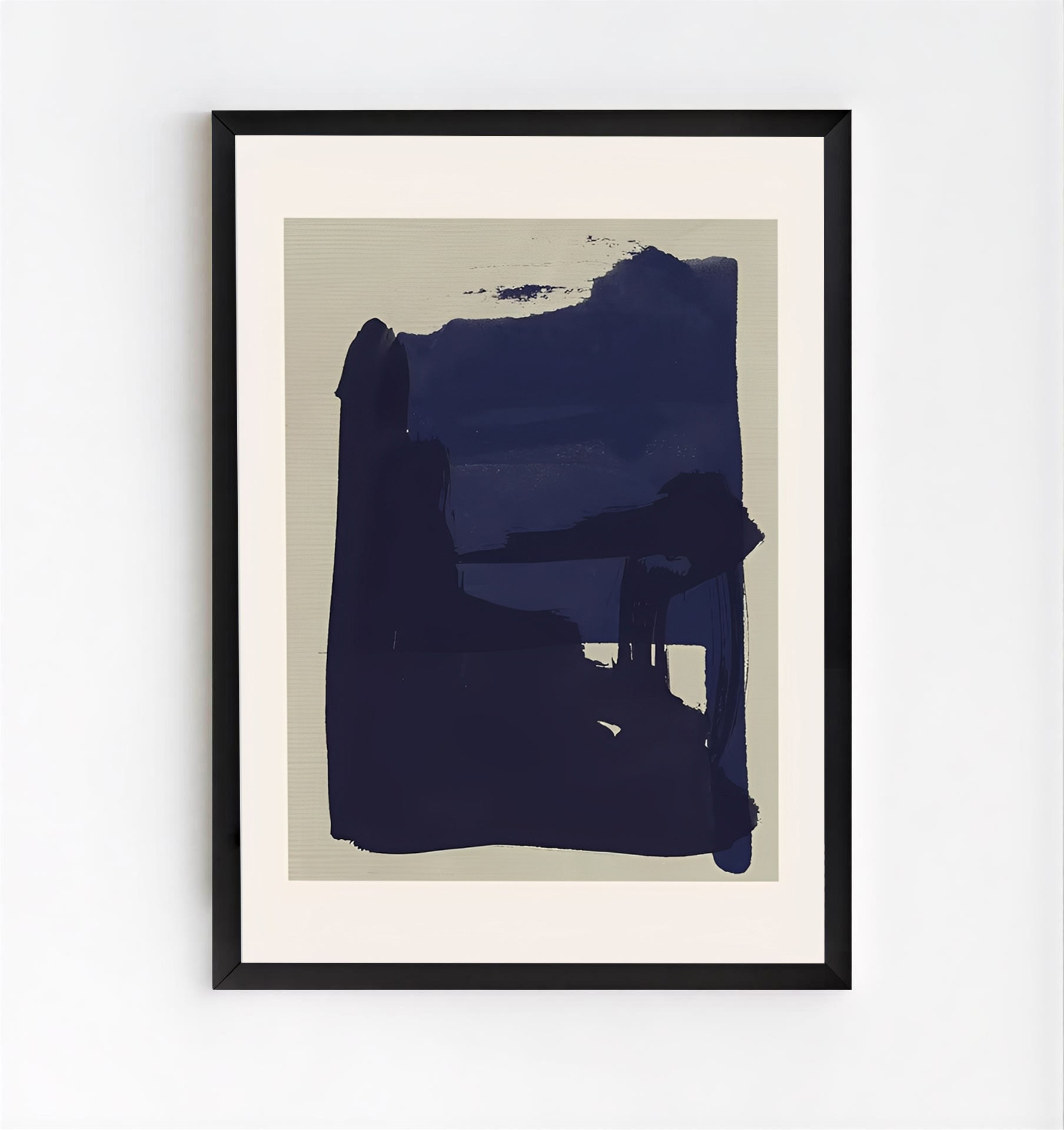 Framed abstract art print with a large blue shape on a beige background