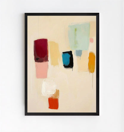 Framed abstract art with colorful blocks on a beige background