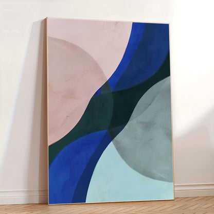 Abstract art piece with blue, green, and pink shapes on a white wall.
