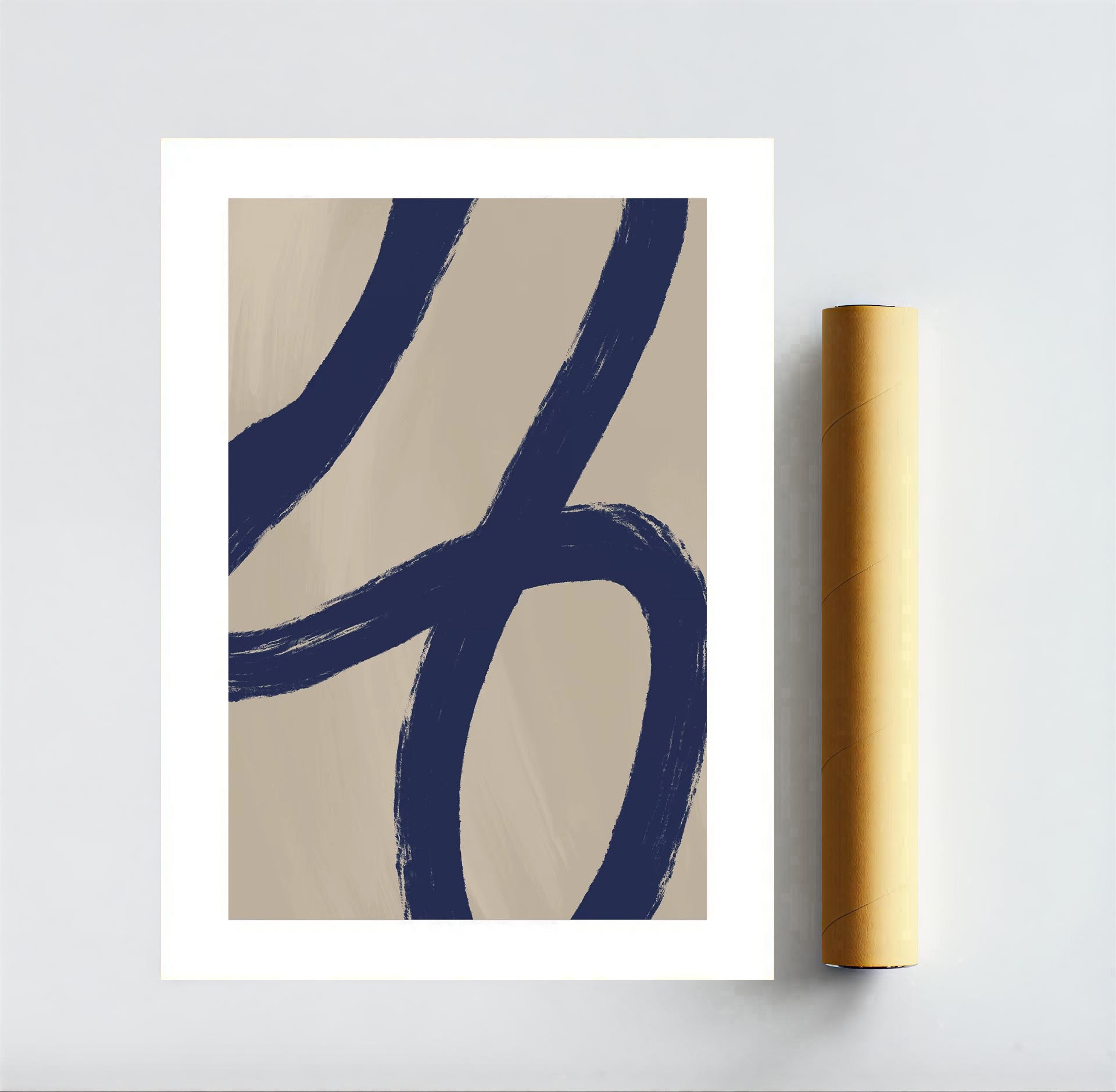 Abstract art print with blue brush strokes on beige background, rolled up yellow paper beside it.