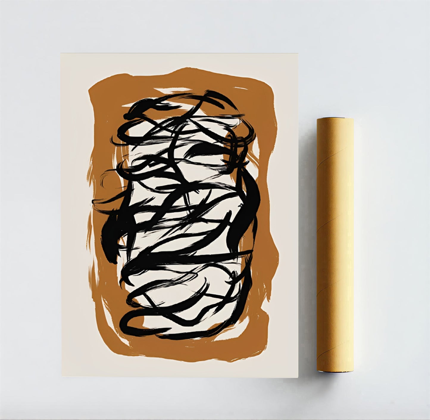 Abstract art print with black wavy lines on a brown and beige background, next to a roll of yellow paper.