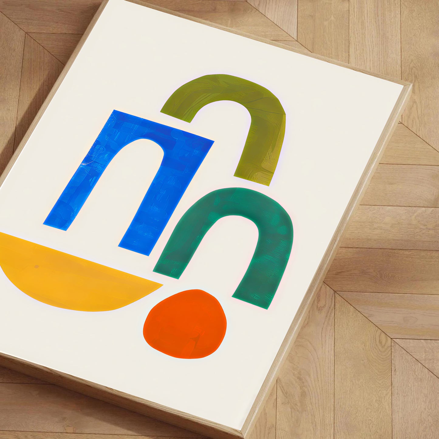 Colorful abstract design on a white background, framed on a wooden floor.