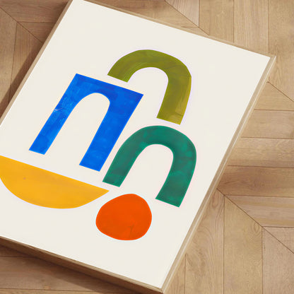 Colorful abstract design on a white background, framed on a wooden floor.