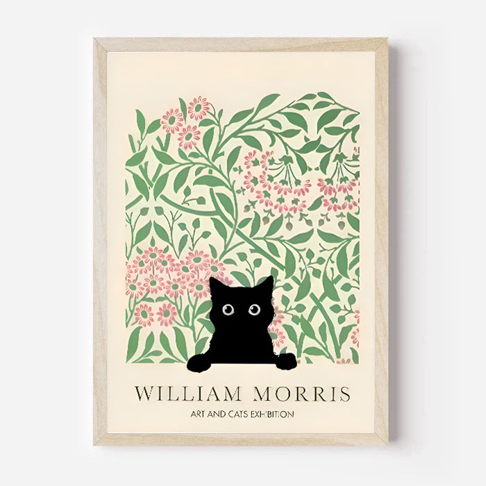 Framed artwork with a black cat art print with floral design, inspired by William Morris, on a white background.