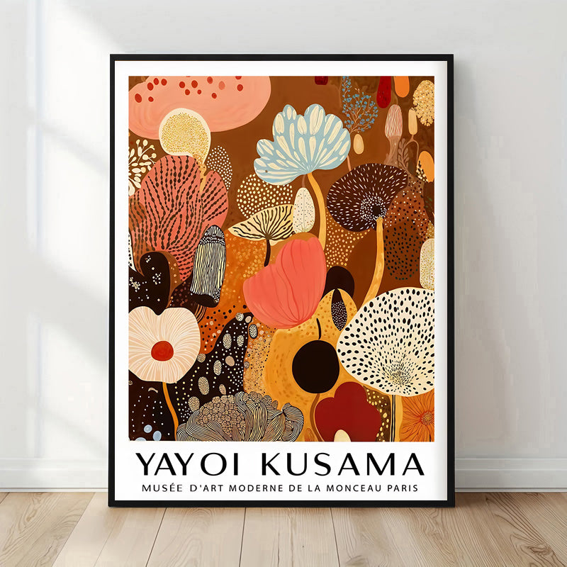 Framed Yayoi Kusama artwork with abstract floral design on a white wall.
