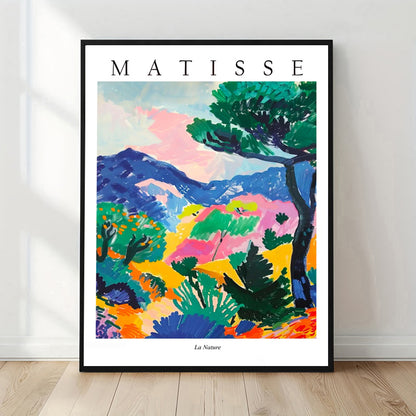 Framed Matisse art print of a colorful landscape on a white wall.