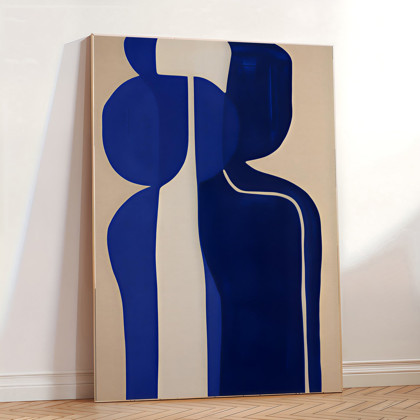 Abstract art piece with blue and beige shapes on a white wall.