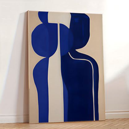 Abstract art piece with blue and beige shapes on a white wall.