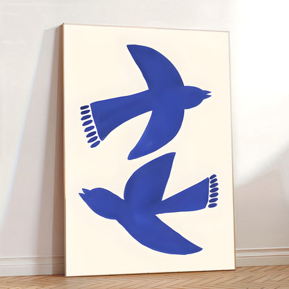 Two blue birds on a white background in a minimalistic room.