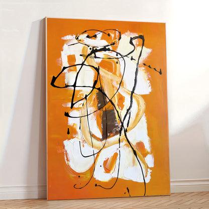 Abstract painting with orange, white, and black on a wall