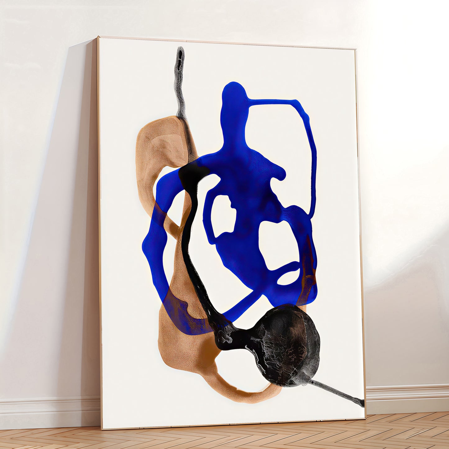 Abstract art piece with blue and black shapes on a white wall