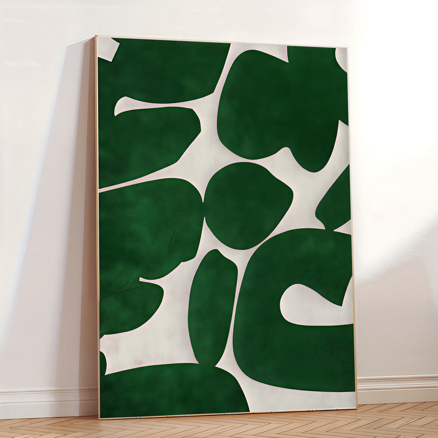 Abstract art piece with green and white shapes on a wall.