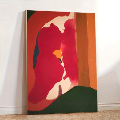 Abstract painting with bold red, orange, and green colors on a white wall.
