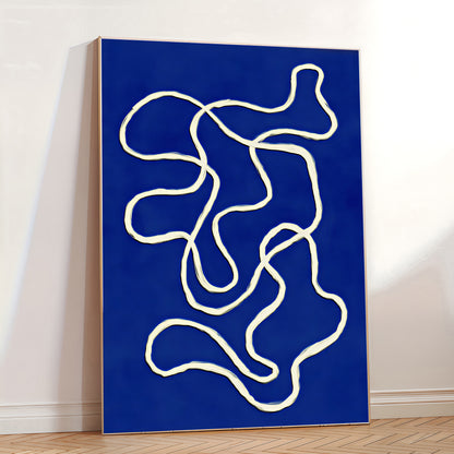 Abstract art piece with white lines on a blue background in a room.