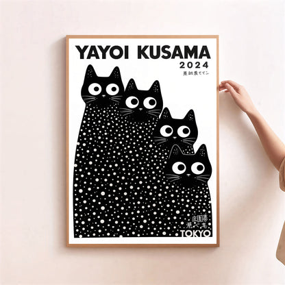 Framed artwork with black and white cat illustration by Yayoi Kusama, 2024, on a light pink background.