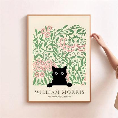 Framed artwork with a black cat art print with floral design, featuring William Morris' name.