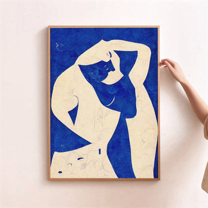 Framed artwork of a stylized figure with blue and beige colors on a light background
