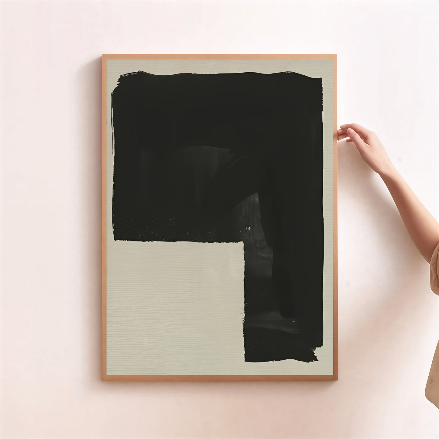 Framed abstract art piece with a large black brushstroke on a light background