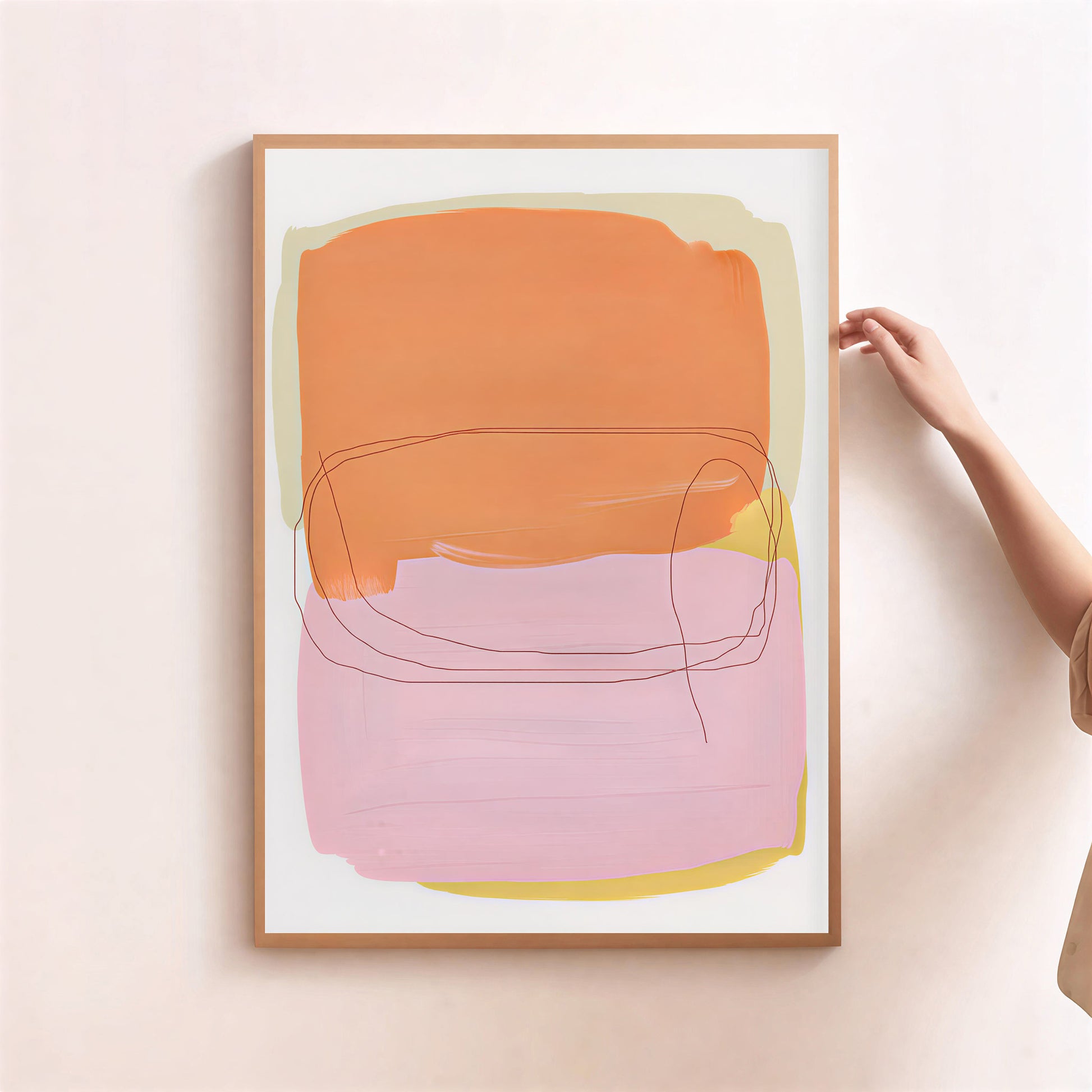 Framed abstract art print with orange and pink colors on a light background