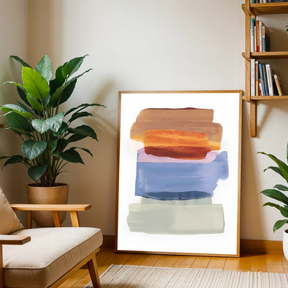 Living room with abstract art, plants, and a bookshelf.