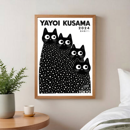 Framed inspired Yayoi Kusama cats artwork with black cats on a white background in a room setting.